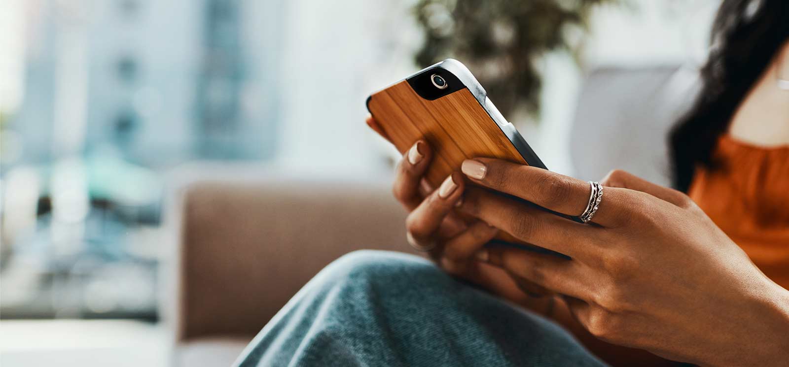 Young person using mobile app to check their bank account.