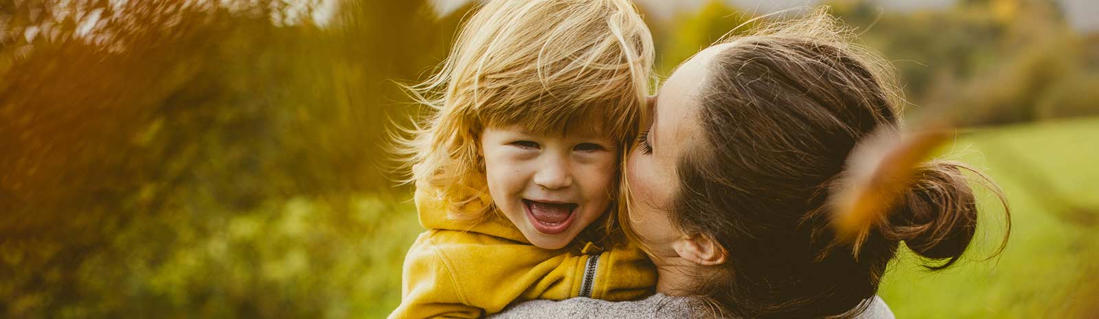 Mother and child outdoors.